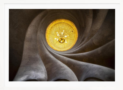 A worm's-eye view of an ornate, golden chandelier set against a swirling, textured dark grey ceiling. The spiraling architectural feature draws the eye to the brightly lit fixture, creating an abstract and dramatic composition. Poster