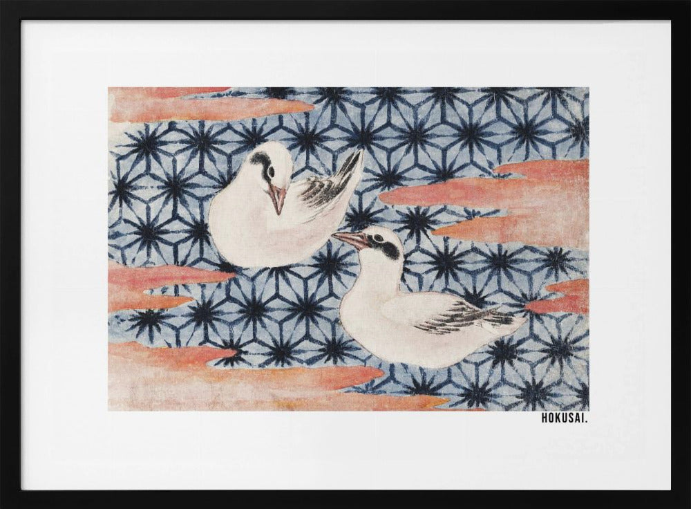 A classic Japanese woodblock print by Hokusai featuring two white birds with black eye markings resting on a background of a traditional blue Asanoha geometric pattern. Soft, reddish-orange cloud-like shapes float across the scene. Print