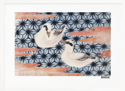 A classic Japanese woodblock print by Hokusai featuring two white birds with black eye markings resting on a background of a traditional blue Asanoha geometric pattern. Soft, reddish-orange cloud-like shapes float across the scene. Print