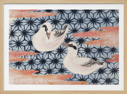 A vintage Japanese woodblock print featuring two white birds with black markings. The birds are set against a blue background with a dark blue Asanoha geometric pattern and reddish-pink, cloud-like shapes. The artwork is enclosed in a silver frame. Wall Art
