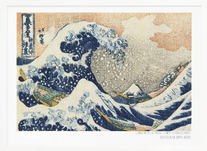 A framed, textured print of Katsushika Hokusai's 'The Great Wave off Kanagawa.' The iconic blue and white wave towers over boats, with a small Mount Fuji in the background under an orange-tinted sky. The artwork has a woven, tapestry-like appearance. Poster