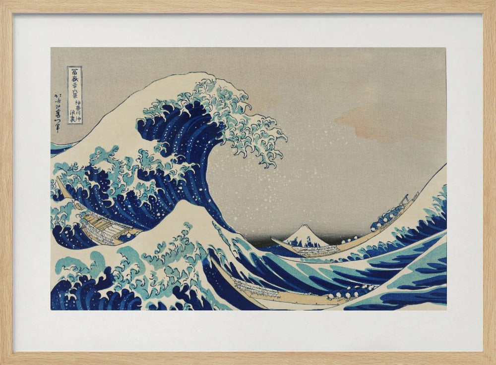 The Great Wave off Kanagawa by Hokusai, a framed Japanese woodblock print depicting a giant, menacing blue and white wave cresting over three boats, with a small Mount Fuji visible in the background under a muted, overcast sky. Artwork