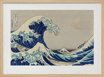 The Great Wave off Kanagawa by Hokusai, a framed Japanese woodblock print depicting a giant, menacing blue and white wave cresting over three boats, with a small Mount Fuji visible in the background under a muted, overcast sky. Artwork