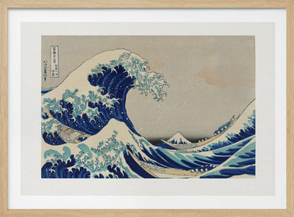 The Great Wave off Kanagawa by Hokusai, a framed Japanese woodblock print depicting a giant, menacing blue and white wave cresting over three boats, with a small Mount Fuji visible in the background under a muted, overcast sky. Artwork