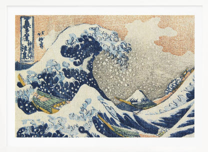 A framed reproduction of Hokusai's 'The Great Wave off Kanagawa,' depicting a massive, curling blue wave with white foam cresting over fishing boats. In the background, a small, snow-capped Mount Fuji stands under a pale orange and grey sky. Poster