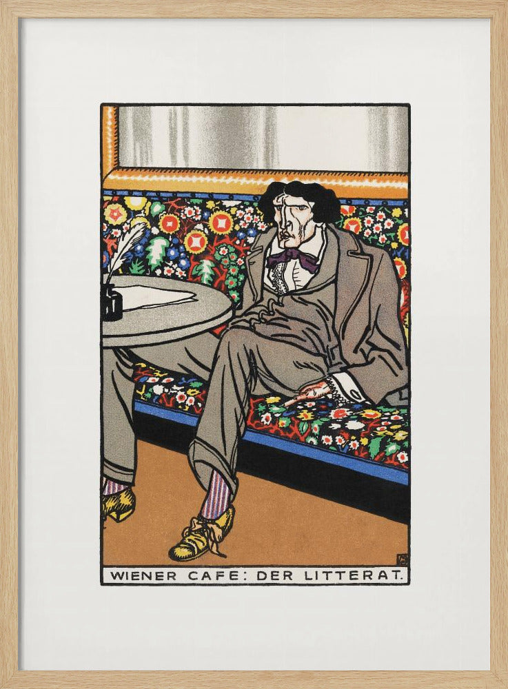 A framed art print titled 'Wiener Cafe: Der Litterat', depicting a stylized illustration of a writer in a Viennese cafe. The man, with a gaunt face and dark hair, sits on a brightly colored, floral-patterned bench, wearing a grey suit, striped socks, and yellow shoes. A table beside him holds an inkwell and quill. Decor