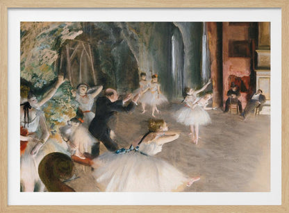 An impressionist painting depicting a ballet rehearsal on a stage. Ballerinas in white tutus practice and stretch while a male instructor in a dark suit directs them. The scene is viewed from the wings, with theatrical scenery in the background and onlookers seated to the right. Wall Art