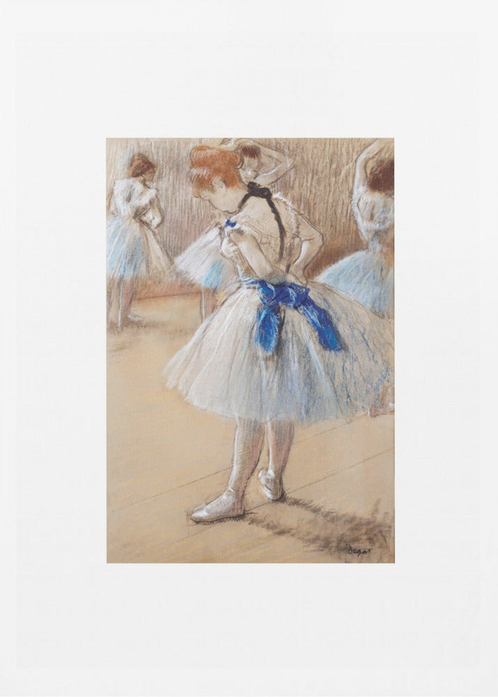 A framed print of an impressionist pastel drawing by Edgar Degas. It shows a ballerina in a white and light blue tutu with a prominent royal blue sash. She is viewed from the side as she adjusts her costume, with other dancers blurred in the background of a dance studio. Poster