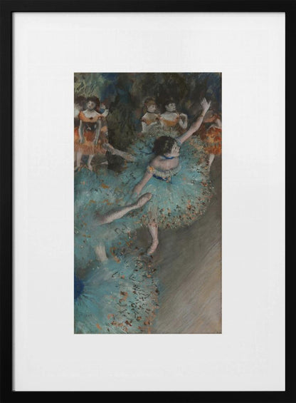 A framed art print of an impressionist painting depicting several ballet dancers on a stage. The central figure is a ballerina in a voluminous light blue tutu, viewed from a high angle. She is mid-pose with arms outstretched. Other dancers in orange and blue costumes are visible in the blurry background. Poster