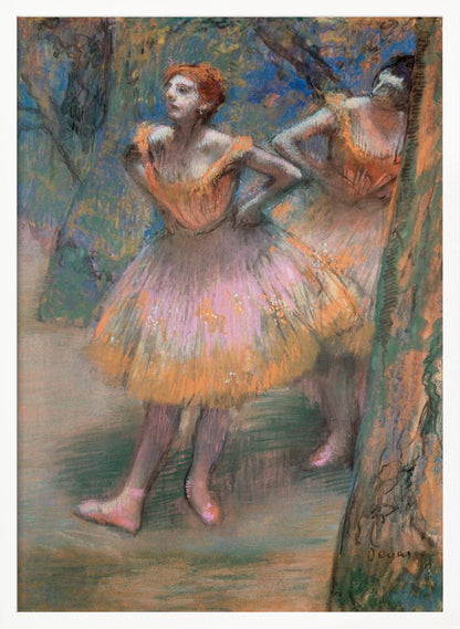 An impressionist pastel painting by Edgar Degas titled 'Dancers in Pink and Orange.' It depicts two ballerinas backstage. The dancer in the foreground has red hair, wears a pink and orange tutu, and stands with her hands on her hips, looking off to the side. A second dancer is partially visible behind her. The background is a textured blend of blues, greens, and browns. Artwork