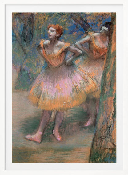 An impressionist pastel painting by Edgar Degas titled 'Dancers in Pink and Orange.' It depicts two ballerinas backstage. The dancer in the foreground has red hair, wears a pink and orange tutu, and stands with her hands on her hips, looking off to the side. A second dancer is partially visible behind her. The background is a textured blend of blues, greens, and browns. Artwork