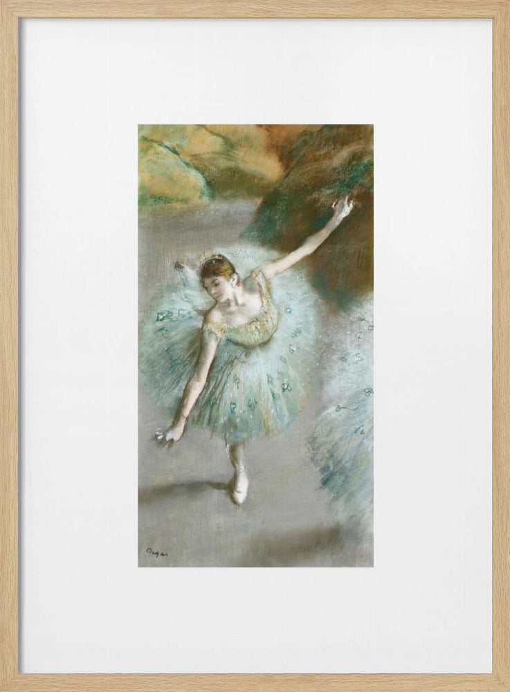 A framed vertical reproduction of an Edgar Degas painting showing a ballerina from a high angle. She wears a voluminous light blue tutu and is posed gracefully with arms outstretched against a soft, impressionistic background of earthy browns and tans. Poster