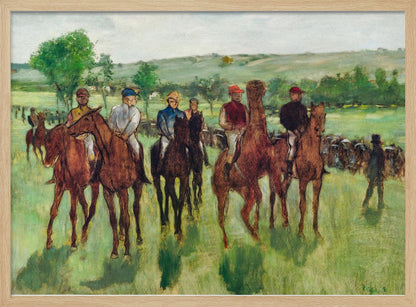 An impressionist painting by Edgar Degas titled 'The False Start', depicting a group of jockeys on their racehorses in a verdant field. The riders are dressed in colorful caps and silks, waiting against a backdrop of rolling green hills and a pale sky. The artwork is displayed in a modern silver frame. Artwork