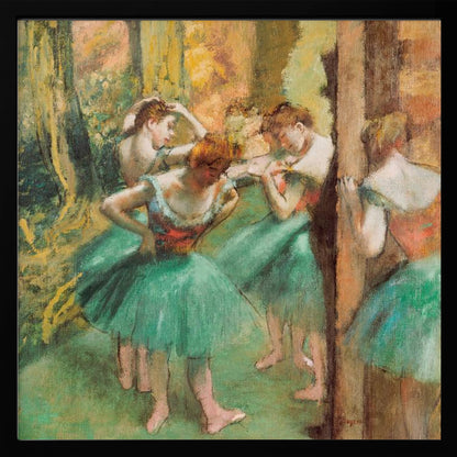 An impressionist painting of four ballet dancers in green tutus backstage. The dancers are adjusting their costumes and hair against a warm, painterly background of yellow, orange, and brown tones. The artwork is displayed in a light wood frame. Wall Art