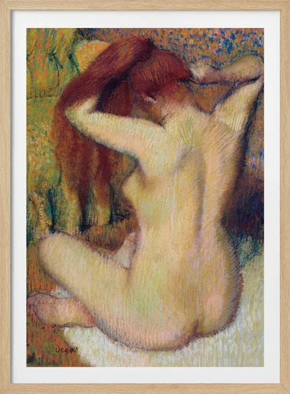 An impressionist pastel painting by Edgar Degas of a nude woman seen from the back. She is sitting on a light-colored surface, gathering her long, auburn hair with both hands behind her head. The background is a textured blend of green, yellow, and blue colors. Poster