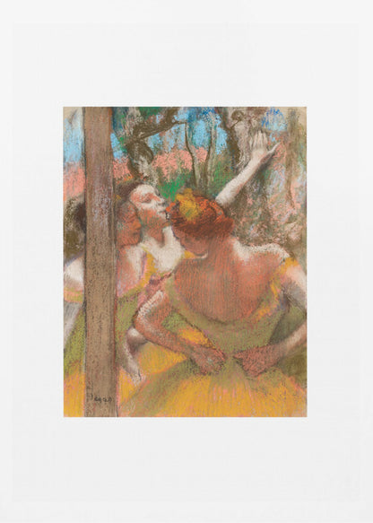 A framed art print of an impressionistic pastel painting by Edgar Degas featuring several ballet dancers backstage. A central figure, seen from behind, adjusts her yellow-green tutu while other dancers stretch in the background. Artwork