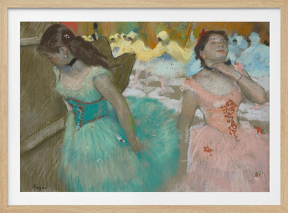 A framed pastel artwork by Edgar Degas depicting several ballerinas. In the foreground, a ballerina in a turquoise tutu looks down, while another in a pink tutu adjusts her collar with her eyes closed. In the background, more dancers in yellow and white are blurred on a stage. Wall Art