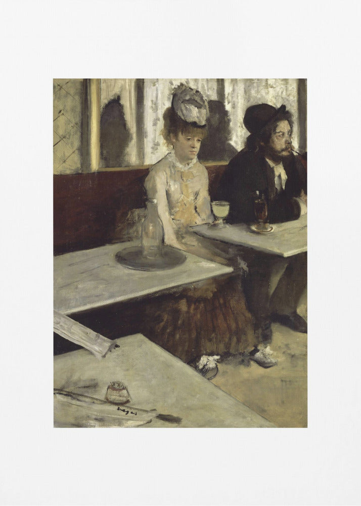 A framed print of Edgar Degas's painting 'L'Absinthe,' depicting a somber-looking man and woman sitting at adjacent tables in a 19th-century Parisian cafe, conveying a sense of alienation and melancholy. Print