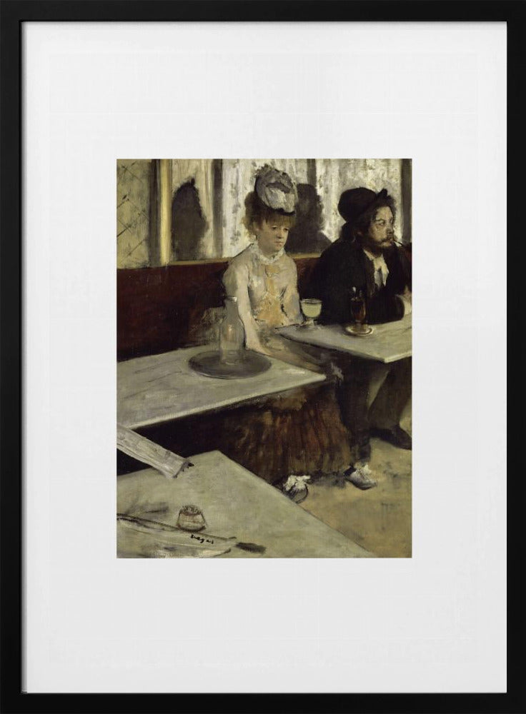 A framed print of Edgar Degas's painting 'L'Absinthe,' depicting a somber-looking man and woman sitting at adjacent tables in a 19th-century Parisian cafe, conveying a sense of alienation and melancholy. Print