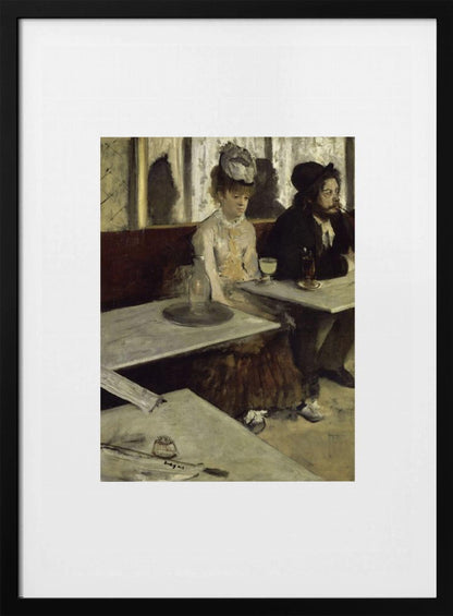 A framed print of Edgar Degas's painting 'L'Absinthe,' depicting a somber-looking man and woman sitting at adjacent tables in a 19th-century Parisian cafe, conveying a sense of alienation and melancholy. Print