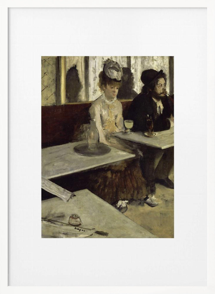 A framed print of Edgar Degas's painting 'L'Absinthe,' depicting a somber-looking man and woman sitting at adjacent tables in a 19th-century Parisian cafe, conveying a sense of alienation and melancholy. Print