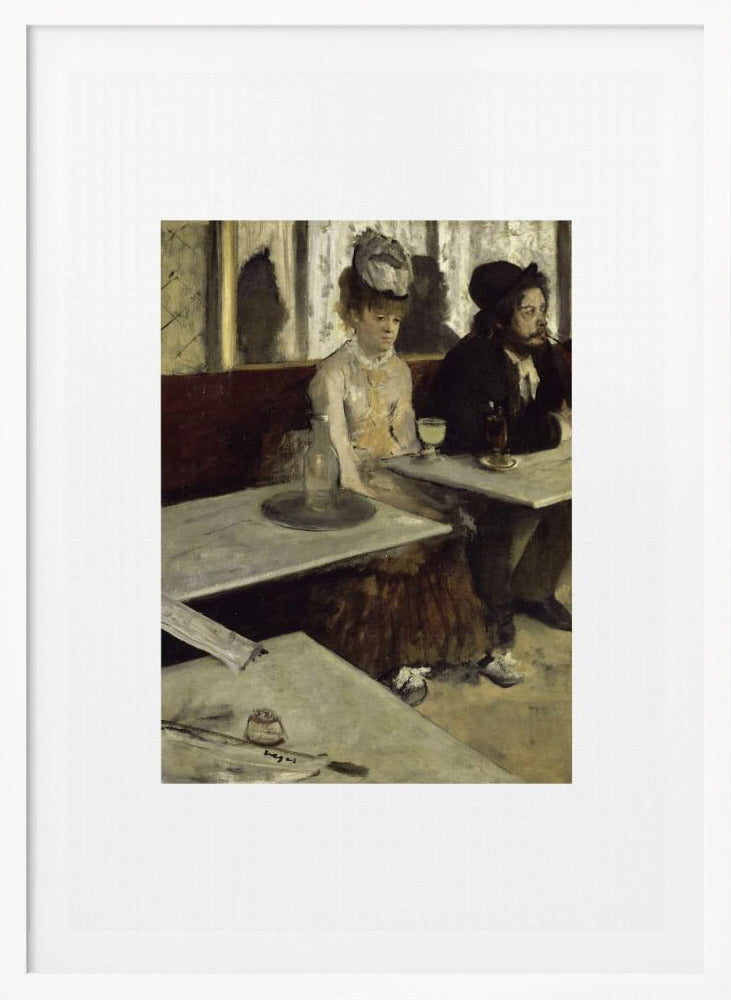 A framed print of Edgar Degas's painting 'L'Absinthe,' depicting a somber-looking man and woman sitting at adjacent tables in a 19th-century Parisian cafe, conveying a sense of alienation and melancholy. Print