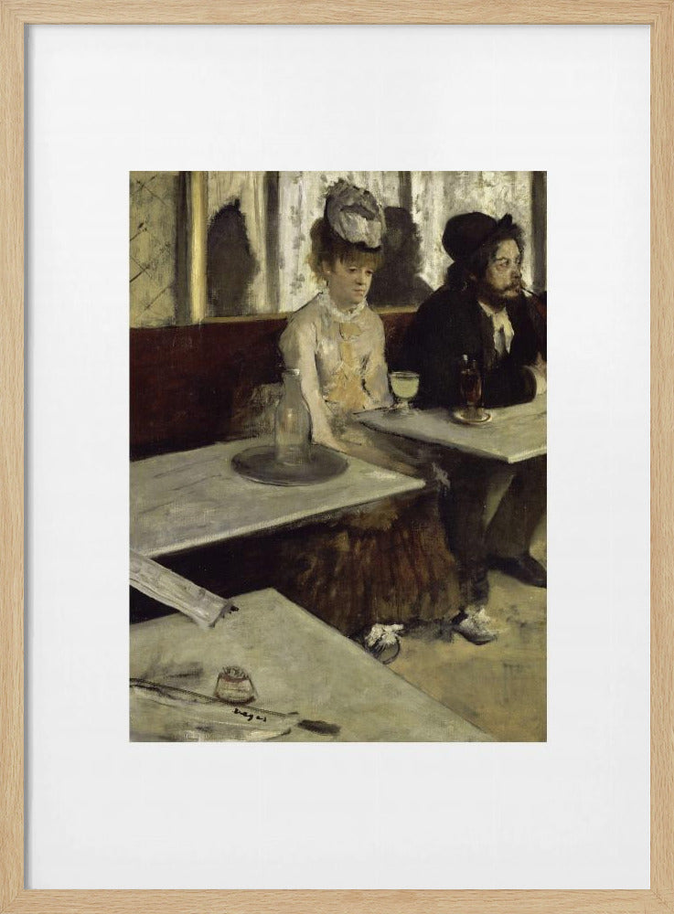 A framed print of Edgar Degas's painting 'L'Absinthe,' depicting a somber-looking man and woman sitting at adjacent tables in a 19th-century Parisian cafe, conveying a sense of alienation and melancholy. Print