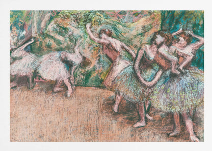 An Impressionist painting by Edgar Degas of ballet dancers on a stage against a green and orange backdrop. The dancers, in various poses, wear tutus in shades of white, pink, and light green. The artwork is framed in a simple silver frame. Artwork