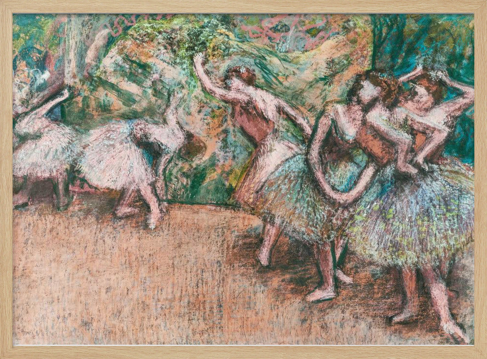 An Impressionist painting by Edgar Degas of ballet dancers on a stage against a green and orange backdrop. The dancers, in various poses, wear tutus in shades of white, pink, and light green. The artwork is framed in a simple silver frame. Artwork