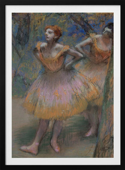 An impressionist pastel painting by Edgar Degas of two ballet dancers. The main dancer in the foreground has red hair and wears a pink and orange tutu. She stands with her hands on her hips, looking off to the left. The background is a blend of blue and green strokes, suggesting a backstage or outdoor setting. Decor