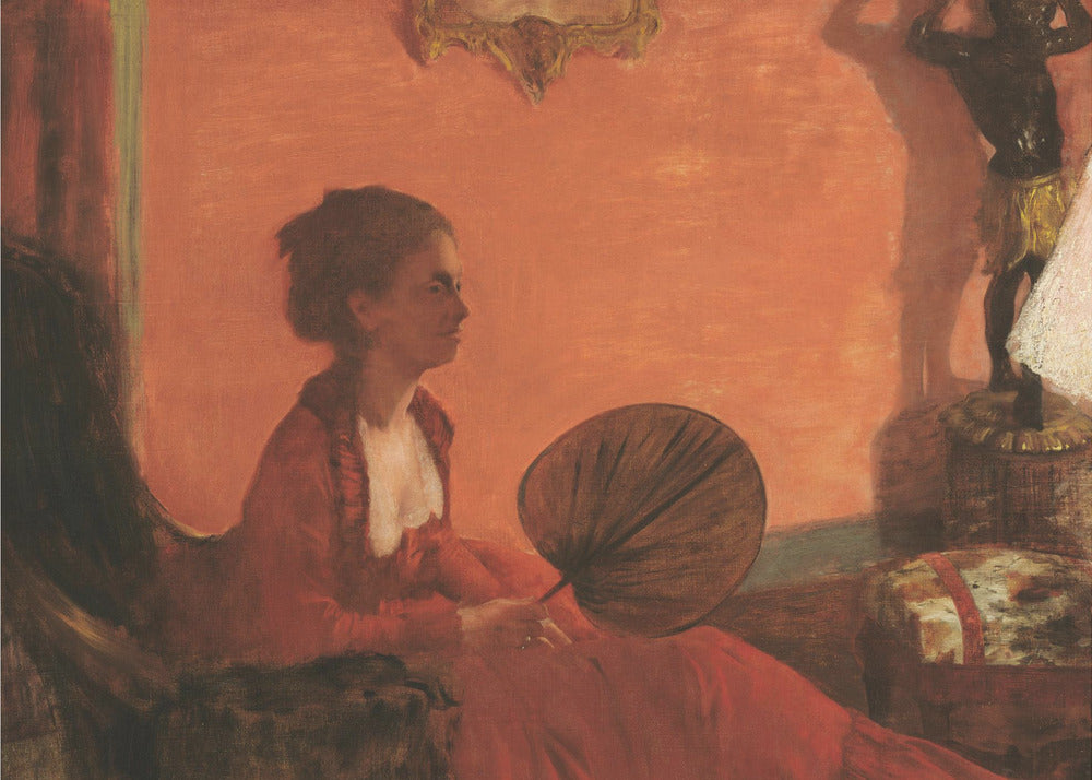 A vintage painting of a woman in profile sitting in a chair against a warm, orange-toned wall. She is wearing a red dress with a white ruffled collar and holding a dark, circular fan in her lap. The room is softly lit, with shadows and a small statue visible in the background. Wall Art