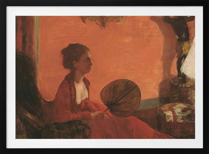 A vintage painting of a woman in profile sitting in a chair against a warm, orange-toned wall. She is wearing a red dress with a white ruffled collar and holding a dark, circular fan in her lap. The room is softly lit, with shadows and a small statue visible in the background. Wall Art