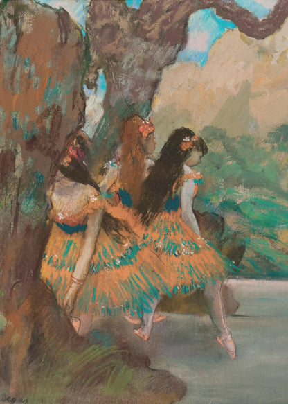 An Impressionist painting by Edgar Degas of three ballet dancers resting. They are wearing vibrant orange and teal tutus and are seated under a large, textured tree trunk with a soft-focus background of green foliage and a hint of blue sky. Wall Art