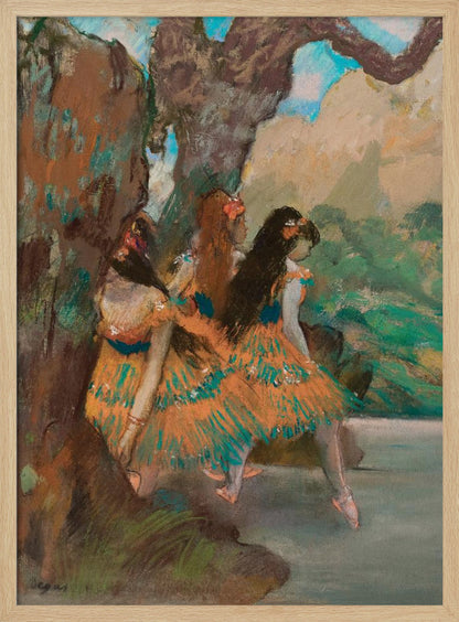 An Impressionist painting by Edgar Degas of three ballet dancers resting. They are wearing vibrant orange and teal tutus and are seated under a large, textured tree trunk with a soft-focus background of green foliage and a hint of blue sky. Wall Art