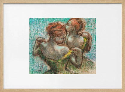 A framed pastel drawing by Edgar Degas, 'Two Dancers', depicting two ballerinas from behind. One dancer in a green dress with a yellow strap adjusts her costume, while another stands closely behind her against a textured turquoise background. The style is Impressionistic, capturing a candid moment. Artwork