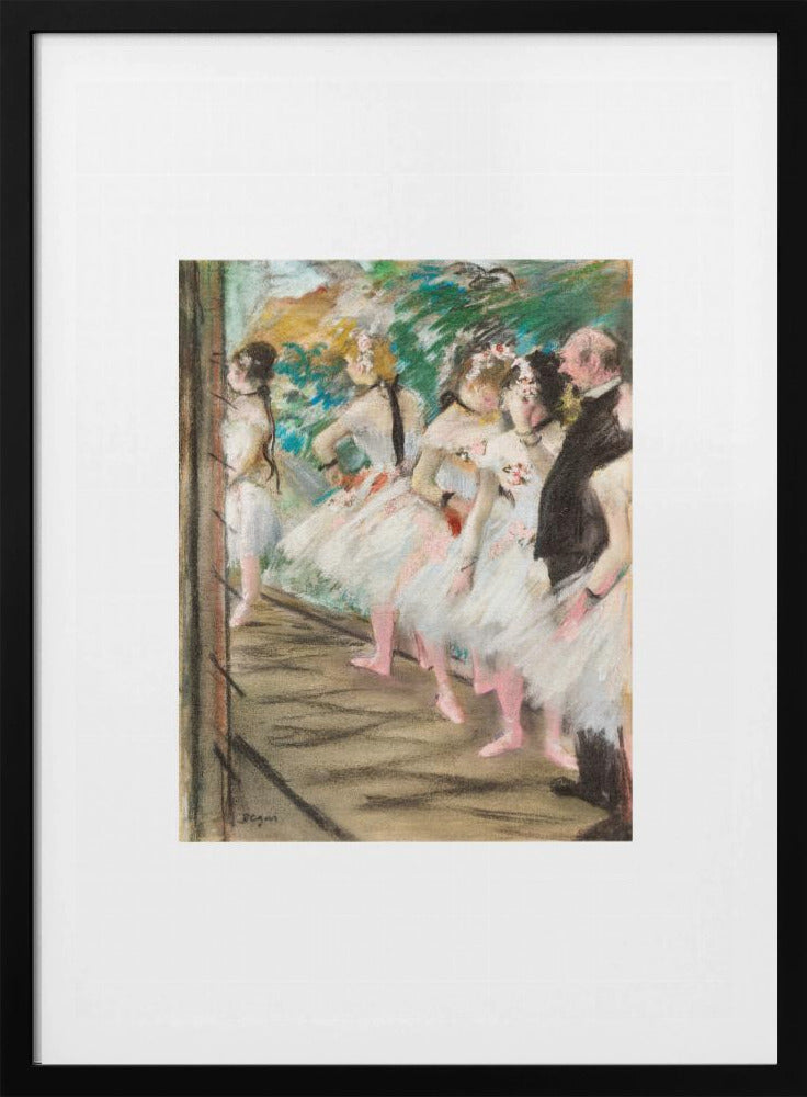 An Impressionist painting by Edgar Degas showing a group of ballet dancers in white tutus waiting in the wings of a stage. A man in a dark suit stands with them. The artwork is presented in a black frame with a white mat. Print