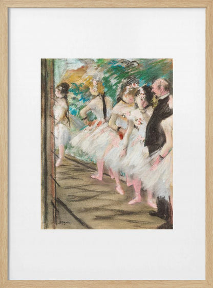 An Impressionist painting by Edgar Degas showing a group of ballet dancers in white tutus waiting in the wings of a stage. A man in a dark suit stands with them. The artwork is presented in a black frame with a white mat. Print