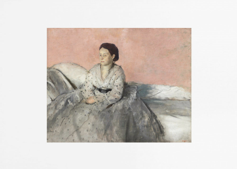 A framed impressionist painting of a woman with dark hair sitting on a bed against a dusty rose background. She wears a white, dotted blouse and a voluminous gray skirt, looking thoughtfully to her left. The painting is set in a silver frame with a white mat. Poster
