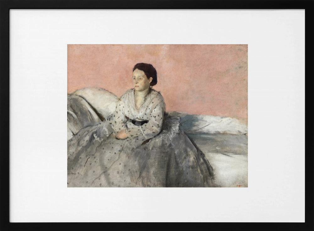 A framed impressionist painting of a woman with dark hair sitting on a bed against a dusty rose background. She wears a white, dotted blouse and a voluminous gray skirt, looking thoughtfully to her left. The painting is set in a silver frame with a white mat. Poster