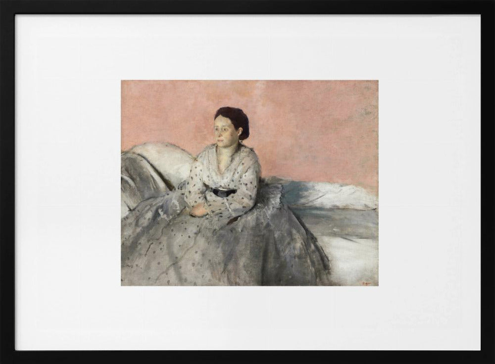 A framed impressionist painting of a woman with dark hair sitting on a bed against a dusty rose background. She wears a white, dotted blouse and a voluminous gray skirt, looking thoughtfully to her left. The painting is set in a silver frame with a white mat. Poster