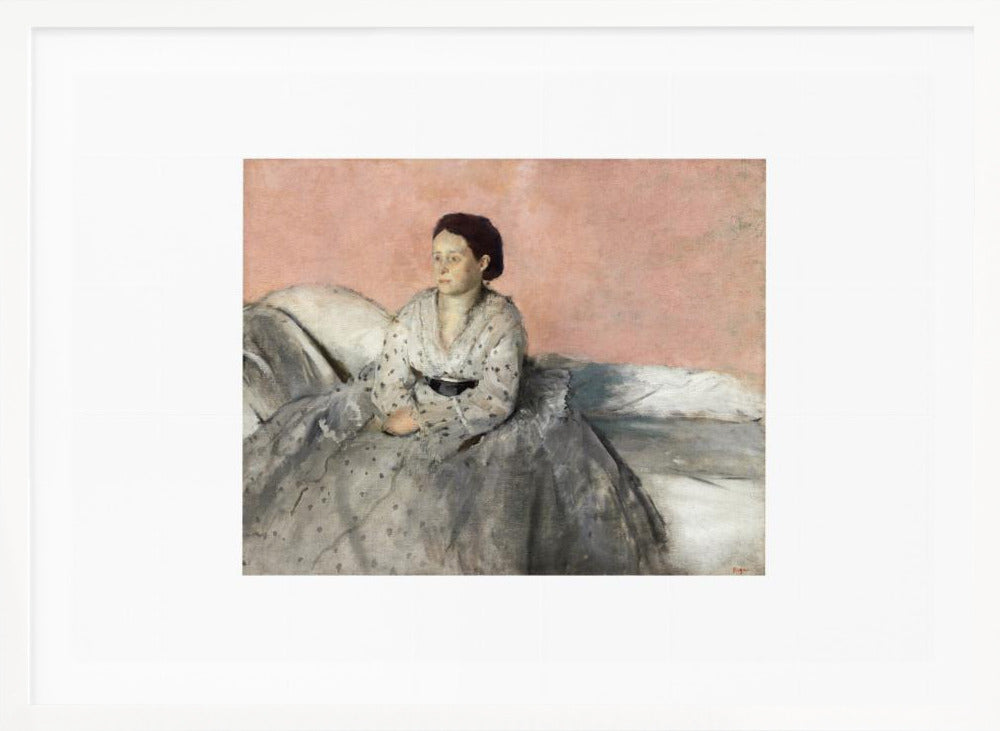 A framed impressionist painting of a woman with dark hair sitting on a bed against a dusty rose background. She wears a white, dotted blouse and a voluminous gray skirt, looking thoughtfully to her left. The painting is set in a silver frame with a white mat. Poster