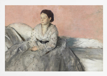 A framed impressionist painting titled 'Mélancolie' by Edgar Degas, depicting a woman with dark hair pulled back, seated on a couch or bed. She wears a white and grey polka-dotted dress with a black sash and has a pensive expression, looking off to the side against a soft pink background. Decor