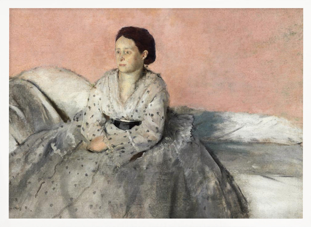A framed impressionist painting titled 'Mélancolie' by Edgar Degas, depicting a woman with dark hair pulled back, seated on a couch or bed. She wears a white and grey polka-dotted dress with a black sash and has a pensive expression, looking off to the side against a soft pink background. Decor