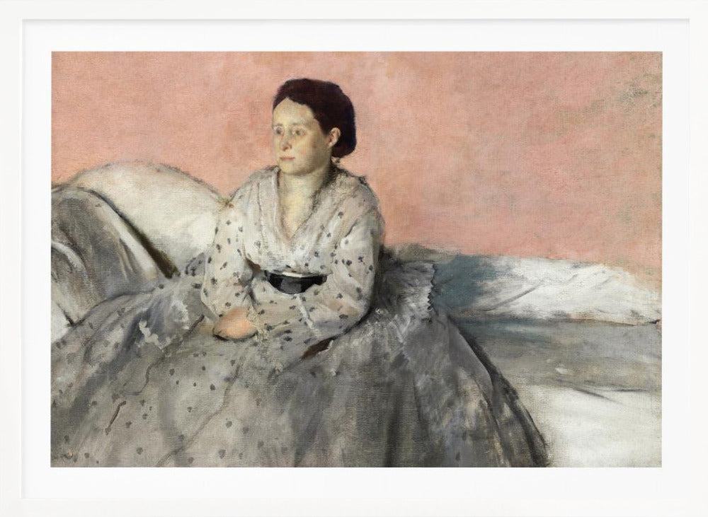 A framed impressionist painting titled 'Mélancolie' by Edgar Degas, depicting a woman with dark hair pulled back, seated on a couch or bed. She wears a white and grey polka-dotted dress with a black sash and has a pensive expression, looking off to the side against a soft pink background. Decor