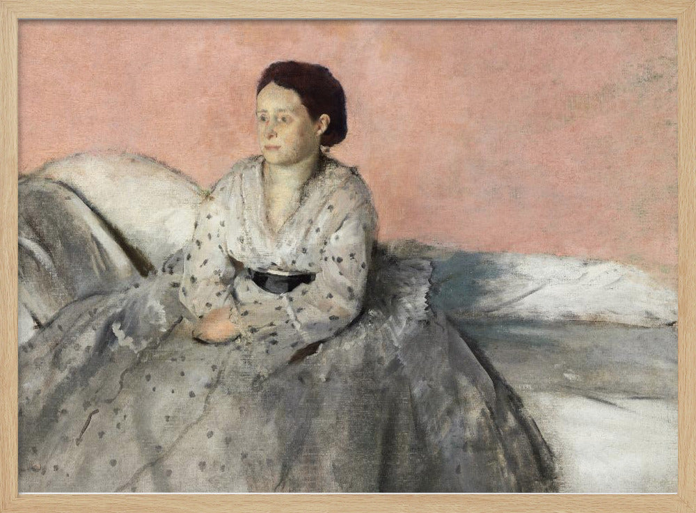 A framed impressionist painting titled 'Mélancolie' by Edgar Degas, depicting a woman with dark hair pulled back, seated on a couch or bed. She wears a white and grey polka-dotted dress with a black sash and has a pensive expression, looking off to the side against a soft pink background. Decor