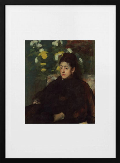 A framed impressionist portrait painting by Edgar Degas of a young woman with dark hair pulled back, wearing a voluminous dark dress. She sits in a chair with a pensive look, set against a background of yellow and white chrysanthemums and dark green foliage. Decor