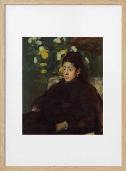 A framed impressionist portrait painting by Edgar Degas of a young woman with dark hair pulled back, wearing a voluminous dark dress. She sits in a chair with a pensive look, set against a background of yellow and white chrysanthemums and dark green foliage. Decor
