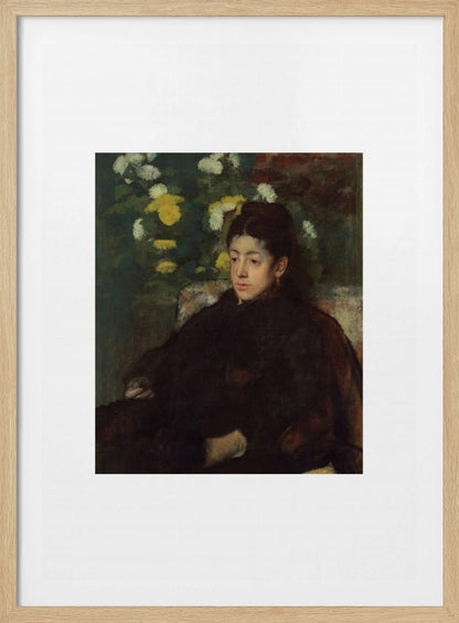 A framed impressionist portrait painting by Edgar Degas of a young woman with dark hair pulled back, wearing a voluminous dark dress. She sits in a chair with a pensive look, set against a background of yellow and white chrysanthemums and dark green foliage. Decor