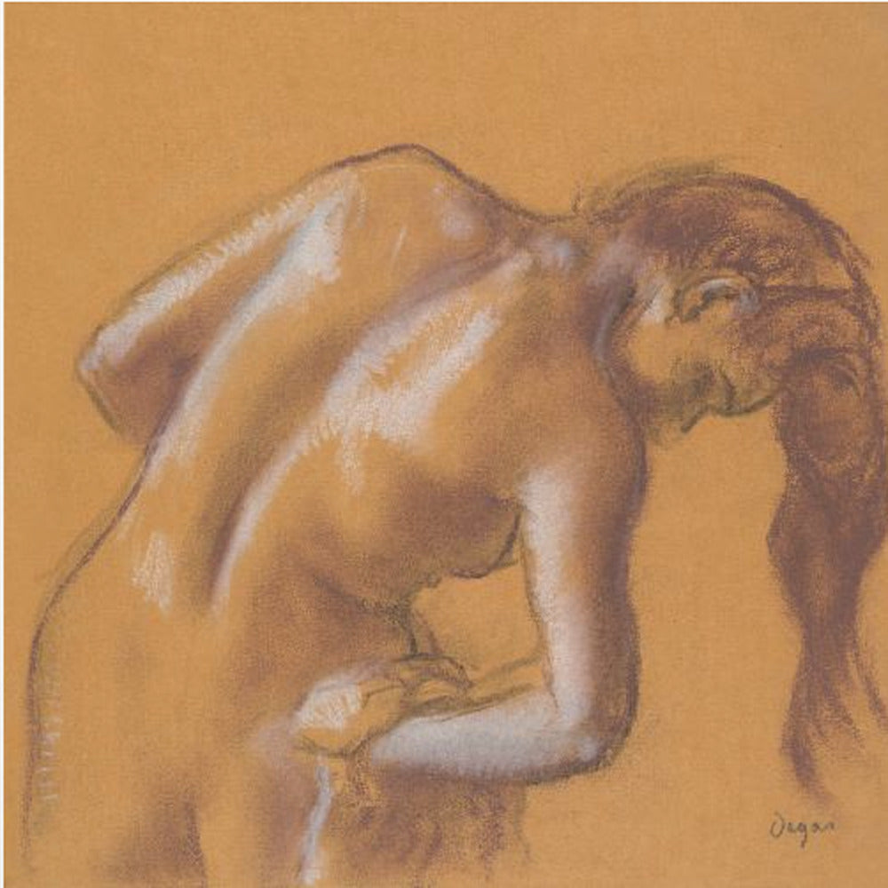 A framed pastel sketch by Edgar Degas titled 'After the Bath, Woman Drying Herself'. The artwork depicts a nude woman from the back, bending forward as if drying herself. The drawing is on a warm ochre-colored paper, with her form defined by brown lines and white highlights, especially along her spine and shoulders. Her long brown hair cascades down on the right side. Wall Art