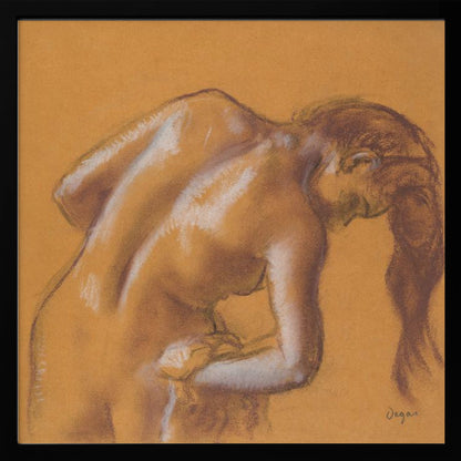 A framed pastel sketch by Edgar Degas titled 'After the Bath, Woman Drying Herself'. The artwork depicts a nude woman from the back, bending forward as if drying herself. The drawing is on a warm ochre-colored paper, with her form defined by brown lines and white highlights, especially along her spine and shoulders. Her long brown hair cascades down on the right side. Wall Art